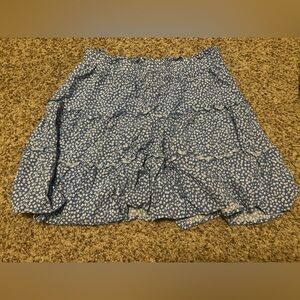 Blue short skirt with white floral print. Size medium from Wild Fable.